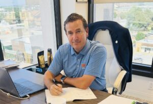 Jared Pope, Co Founder and CEO of Work Shield, writing notes at his desk during a discussion on workplace investigation risk