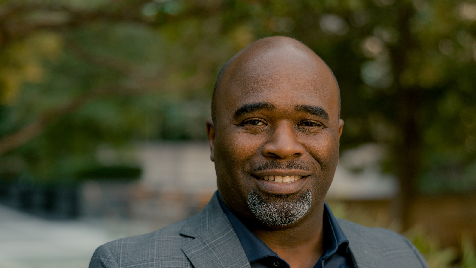 Travis Foster, Chief Legal Officer at Work Shield, in a professional outdoor portrait